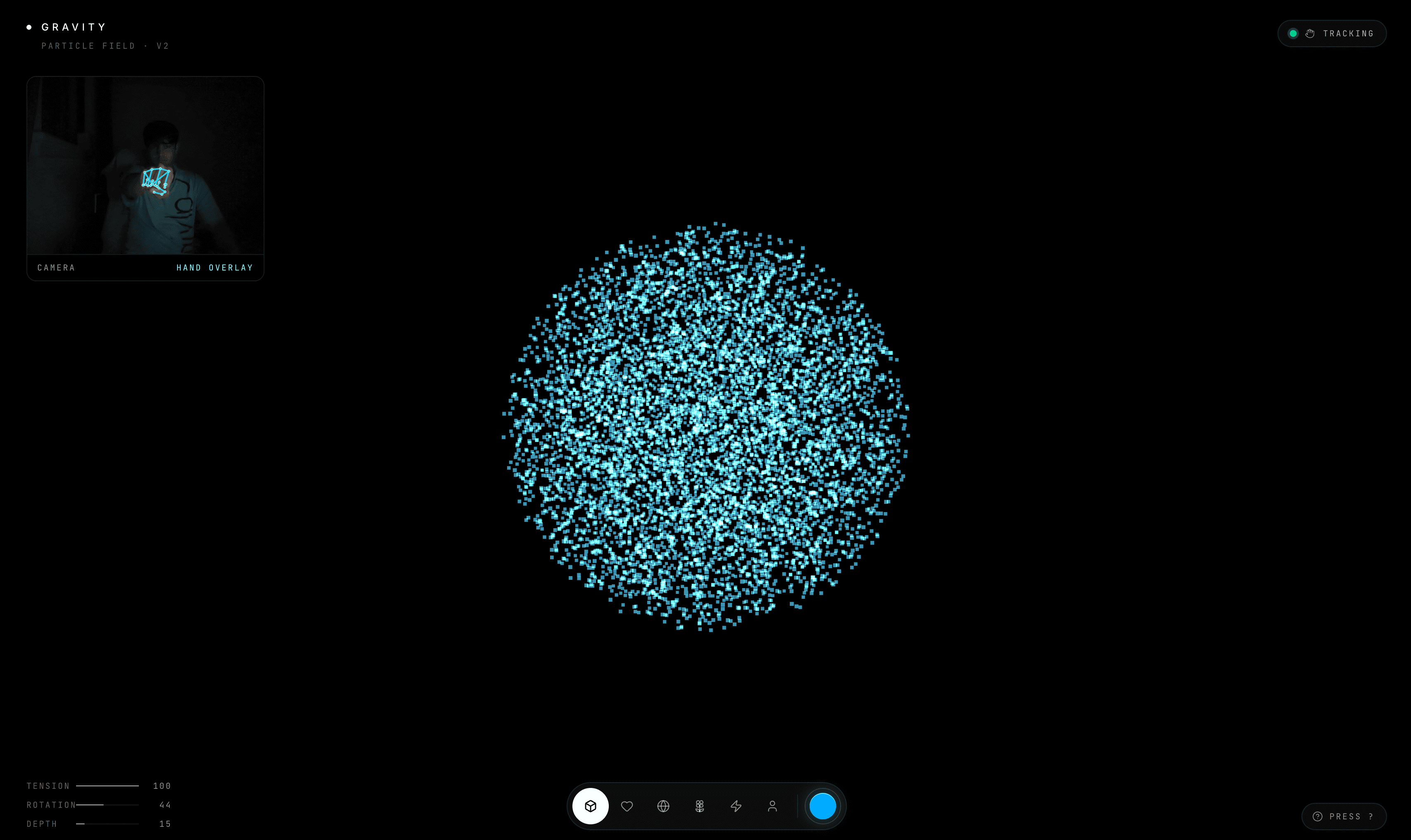 Gravity hand-tracking particle field with a camera overlay and cyan particles.