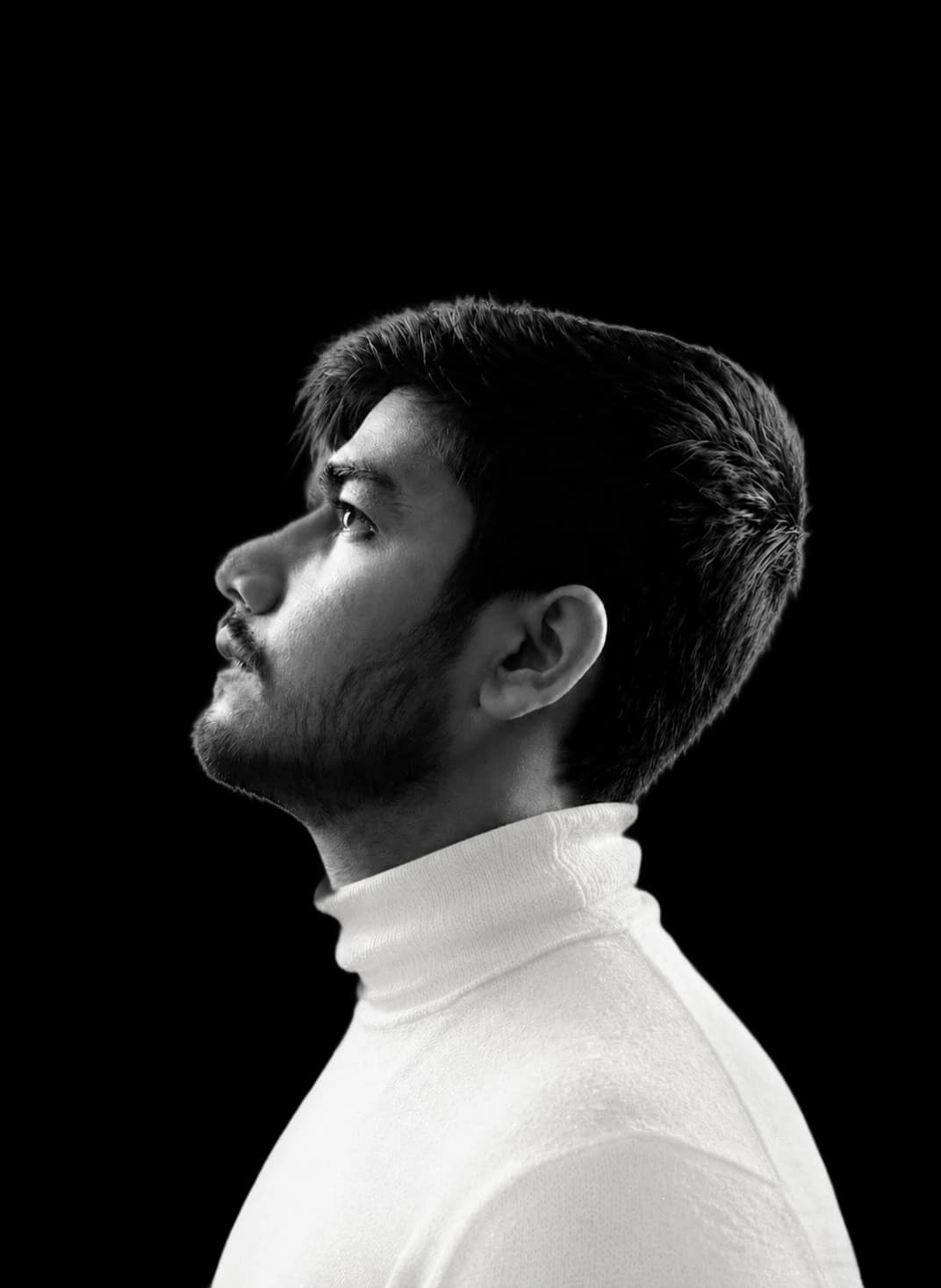 Rishi Ashar in a black and white profile portrait